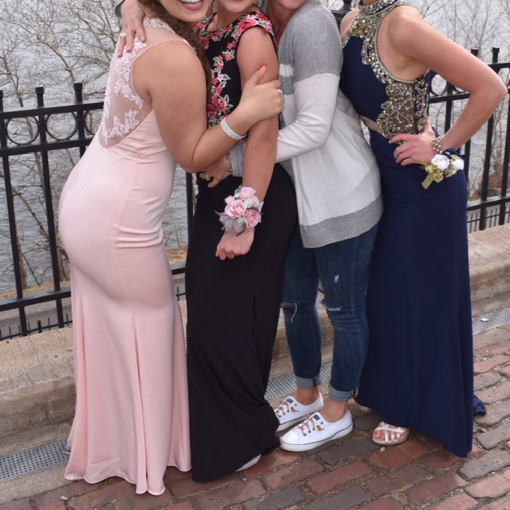 The pink dress on the far left!